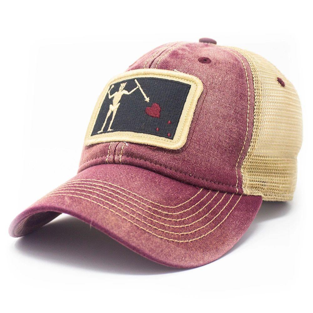 Brick red trucker hat with embroidered Blackbeard pirate flag patch on the center and khaki mesh back panels. Patch depicts a natural colored skeleton with horns piercing a red bleeding heart with a spear. 
